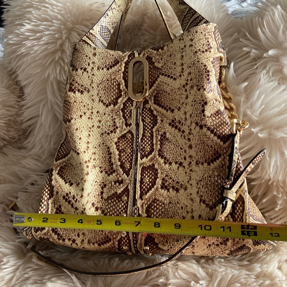 Michael Kors snake print with beautiful gold hardware.